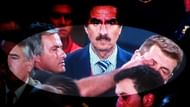 Jose Mourinho pokes Tito Vilanova in the eye.